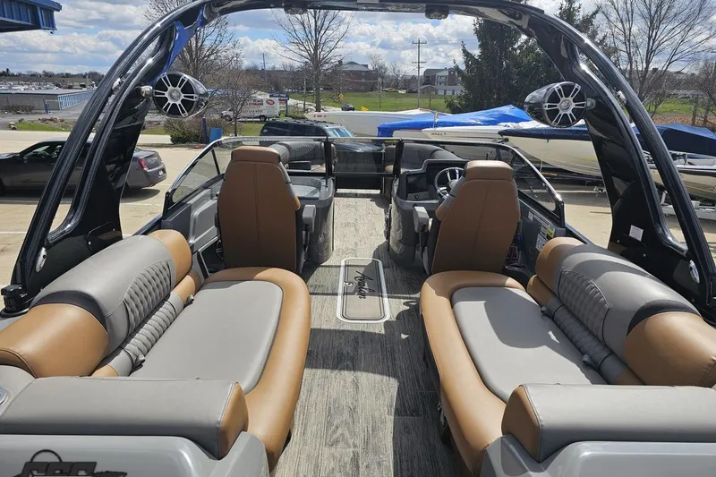 Slide: The Image of 2024 Avalon Excalibur Quad Lounge boat interior with luxurious seating and modern design. - 49