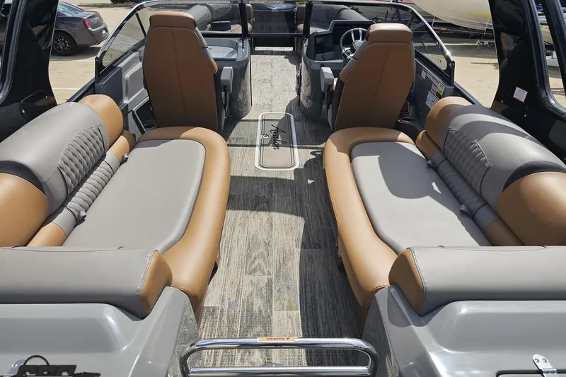 Slide: The Image of 2024 Avalon Excalibur Quad Lounge Windshield boat interior with luxurious seating. - 50