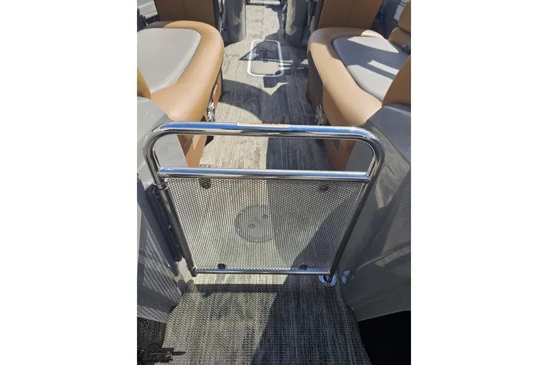 Slide: The Image of 2024 Avalon Excalibur Quad Lounge interior with metal gate and cushioned seating. - 52