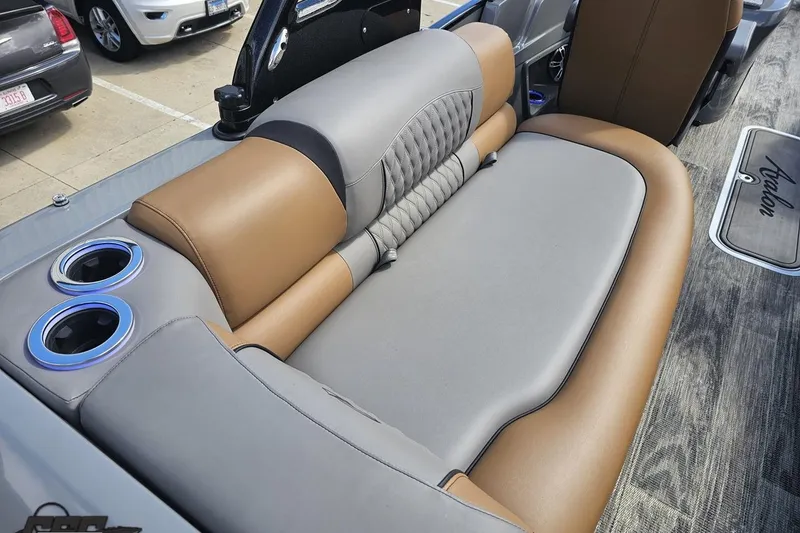 Slide: The Image of 2024 Avalon Excalibur Quad Lounge interior with luxurious seating and cup holders. - 58
