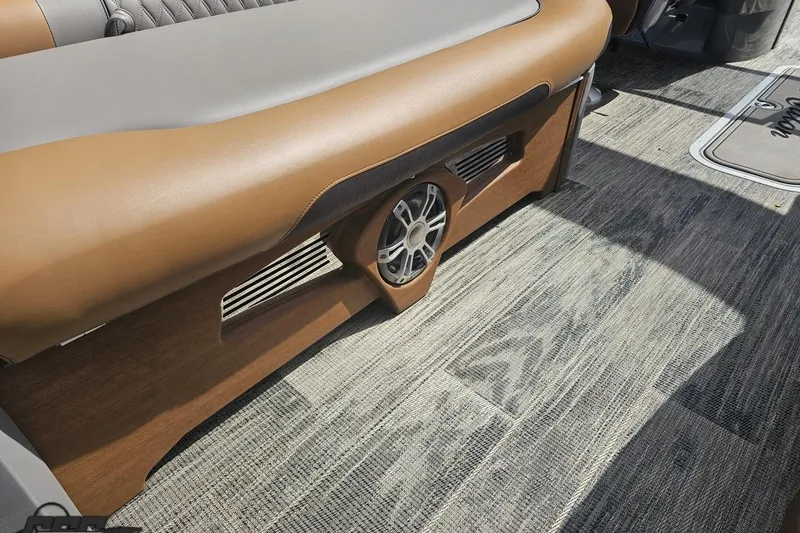 Slide: The Image of 2024 Avalon Excalibur Quad Lounge interior with stylish seating and speaker detail. - 59