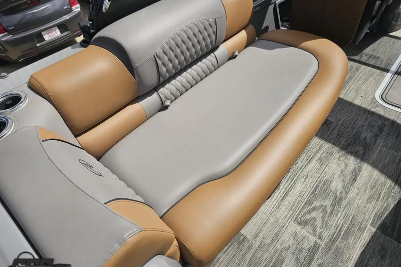 Slide: The Image of 2024 Avalon Excalibur Quad Lounge interior with luxurious tan and gray seating. - 60