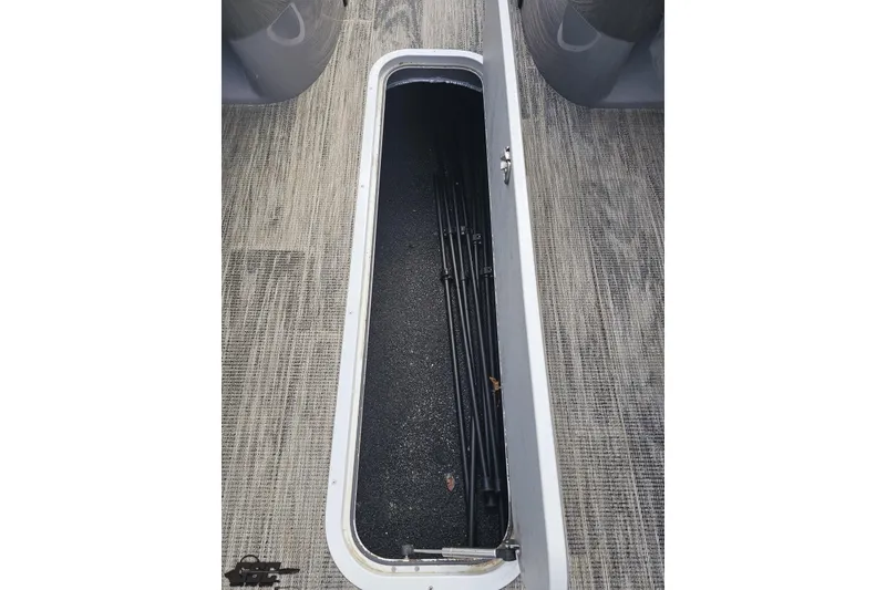Slide: The Image of Storage compartment on 2024 Avalon Excalibur Quad Lounge Windshield boat, showcasing interior space. - 64