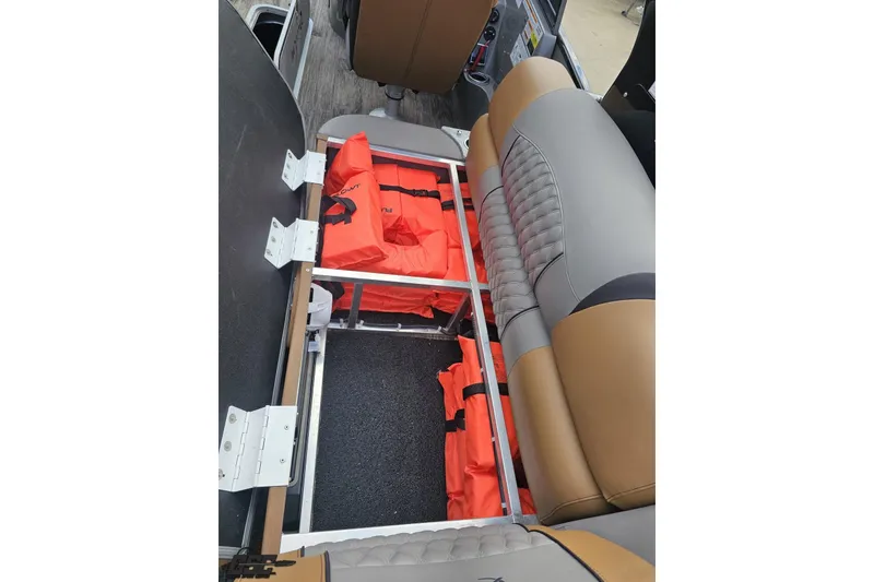 Slide: The Image of 2024 Avalon Excalibur Quad Lounge storage with life jackets under seat. - 65