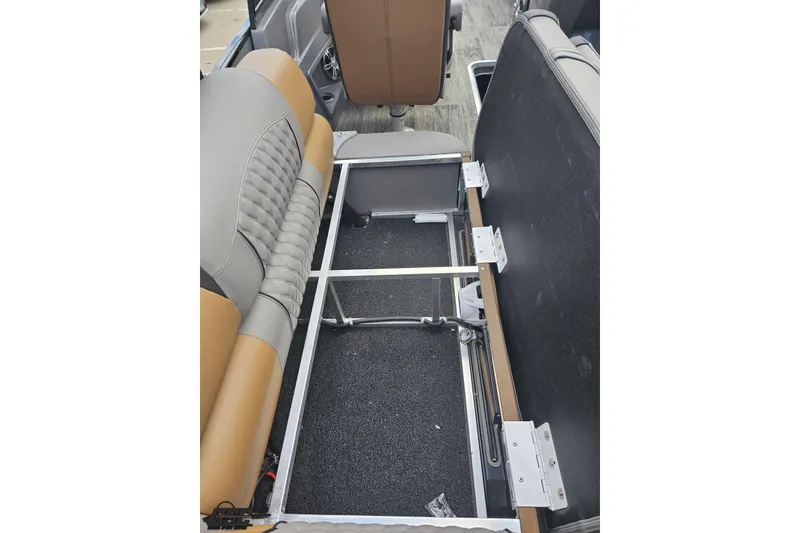 Slide: The Image of 2024 Avalon Excalibur Quad Lounge interior storage compartment, showcasing seating and upholstery details. - 66