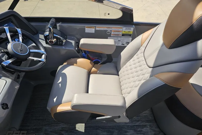 Slide: The Image of Luxurious captain's chair and steering console in 2024 Avalon Excalibur Quad Lounge boat. - 75