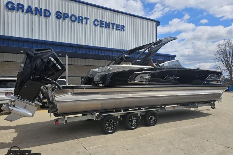 Slide: The Image of 2024 Avalon Excalibur Quad Lounge boat at Grand Sport Center, featuring sleek design and Mercury engine. - 8