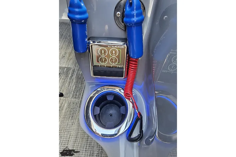 Slide: The Image of Control panel and cup holder on 2024 Avalon Excalibur Quad Lounge Windshield boat. - 84