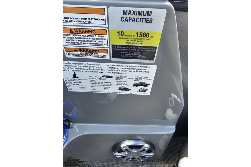 Slide: The Image of 2024 Avalon Excalibur boat capacity and safety warning labels with speaker detail. - 85