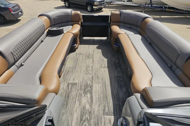 Slide: The Image of 2024 Avalon Excalibur Quad Lounge boat interior with luxurious seating and modern design. - 87