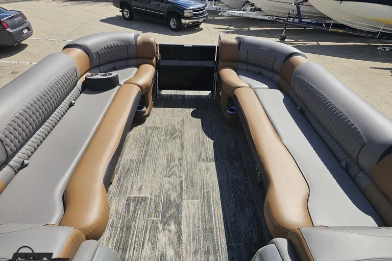 Slide: The Image of 2024 Avalon Excalibur Quad Lounge boat interior with luxurious seating and modern design. - 89