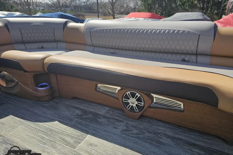 Slide: The Image of Luxurious seating in 2024 Avalon Excalibur Quad Lounge Windshield boat, featuring elegant design and premium materials. - 91