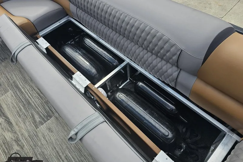 Slide: The Image of 2024 Avalon Excalibur Quad Lounge storage compartment with sleek upholstery and hidden storage space. - 92