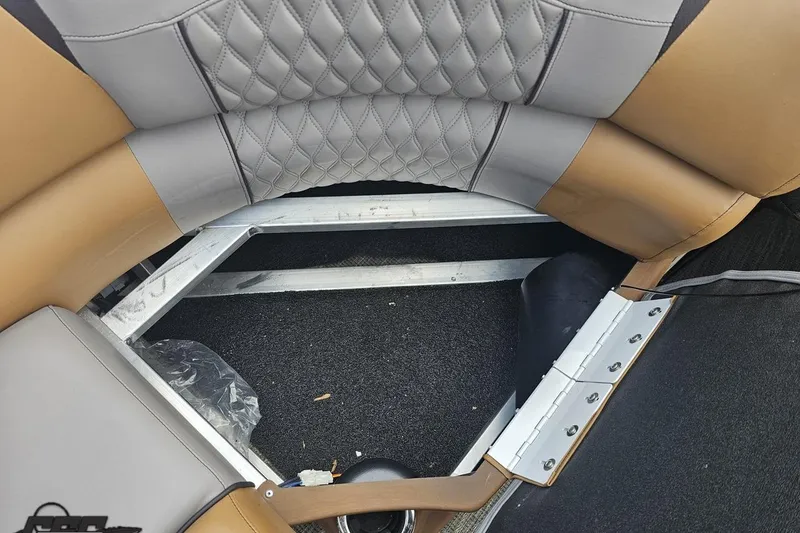 Slide: The Image of 2024 Avalon Excalibur Quad Lounge interior with diamond-stitched upholstery and metal frame detail. - 97