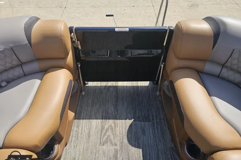 Slide: The Image of 2024 Avalon Excalibur Quad Lounge interior with tan and gray seating, showcasing luxury design. - 98