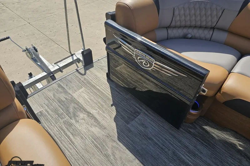 Slide: The Image of 2024 Avalon Excalibur Quad Lounge interior with luxurious seating and stylish flooring. - 99