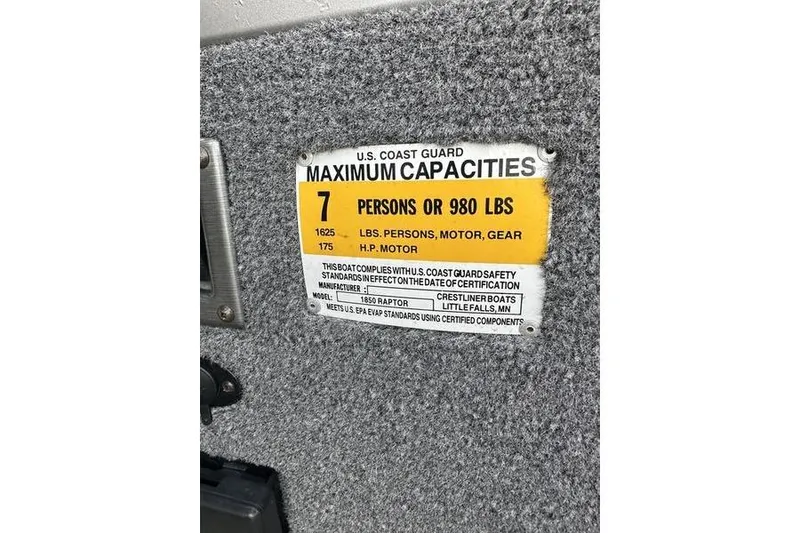 Slide: The Image of U.S. Coast Guard capacity label on 2011 Crestliner 1850 Fish Hawk SC boat. - 2