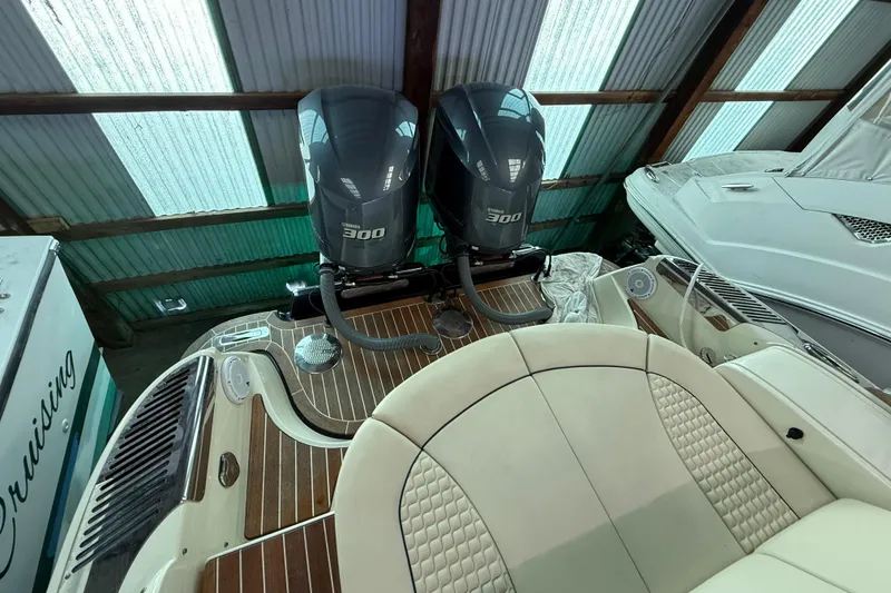 Slide: The Image of 2021 Chris-Craft Launch 31 GT with twin Yamaha 300 engines in a covered dock. - 11