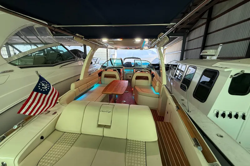 Slide: The Image of 2021 Chris-Craft Launch 31 GT boat interior with elegant seating and American flag. - 12