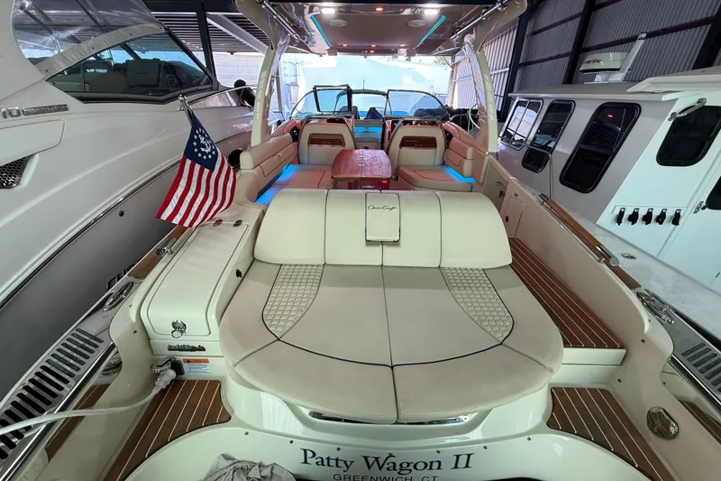 Slide: The Image of 2021 Chris-Craft Launch 31 GT boat interior with seating and American flag. - 13