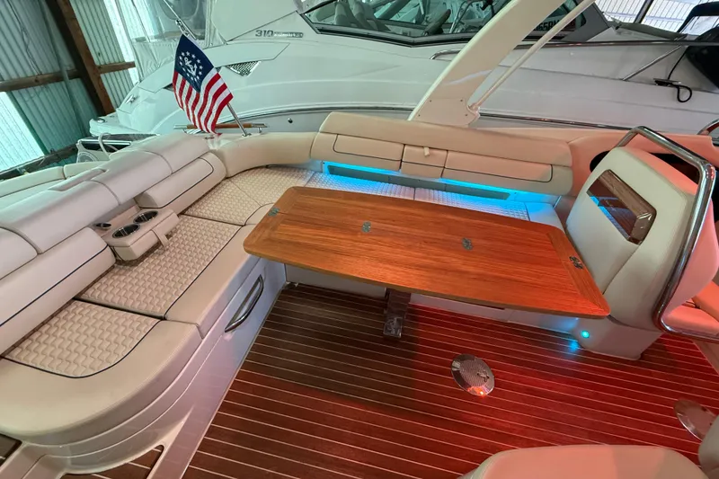 Slide: The Image of Luxurious 2021 Chris-Craft Launch 31 GT boat interior with elegant seating and wooden table. - 16