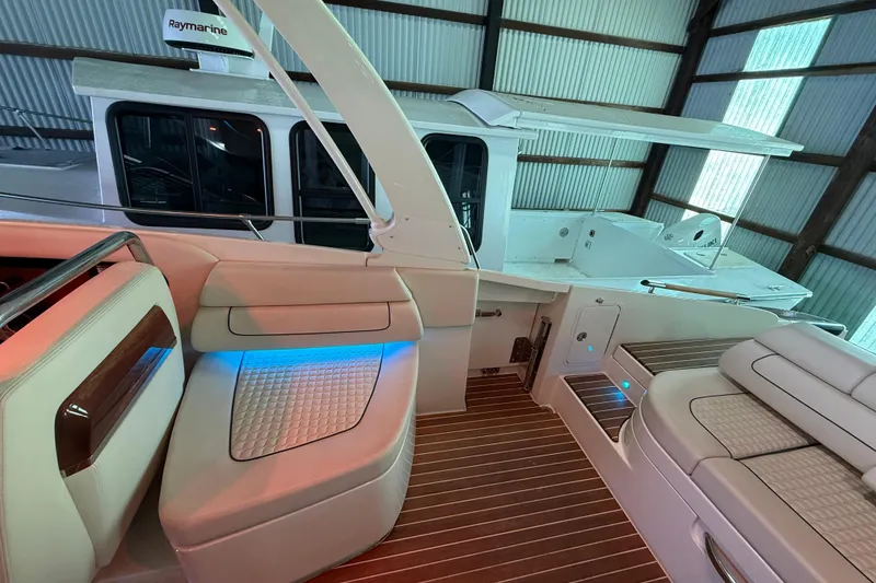 Slide: The Image of 2021 Chris-Craft Launch 31 GT interior with luxurious seating and ambient lighting. - 18