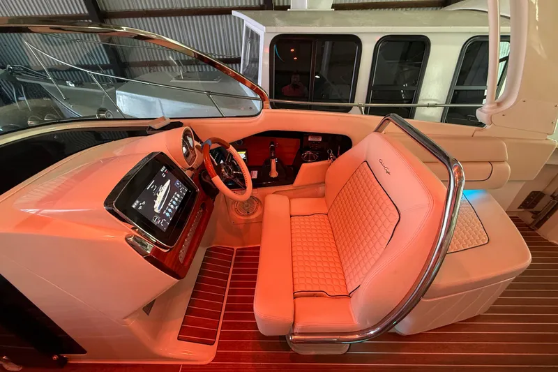 Slide: The Image of Luxurious 2021 Chris-Craft Launch 31 GT cockpit with elegant seating and advanced controls. - 24