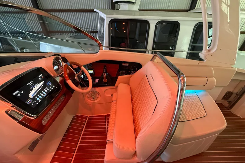 Slide: The Image of 2021 Chris-Craft Launch 31 GT cockpit with luxurious seating and advanced dashboard controls. - 25