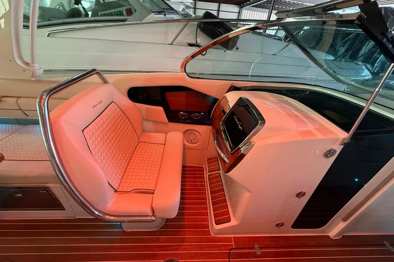 Slide: The Image of Interior of 2021 Chris-Craft Launch 31 GT, featuring luxurious seating and sleek dashboard design. - 29