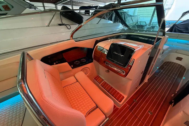 Slide: The Image of 2021 Chris-Craft Launch 31 GT interior with luxurious seating and elegant dashboard design. - 31