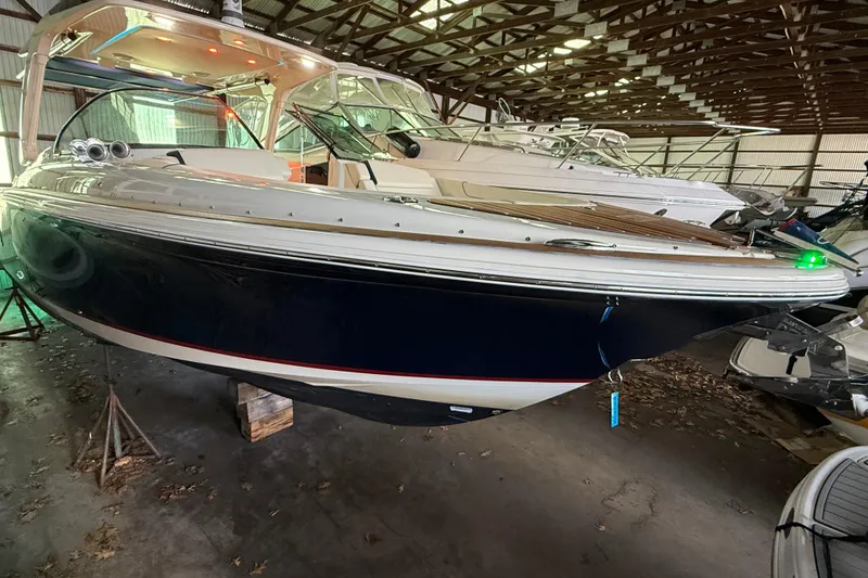 Slide: The Image of 2021 Chris-Craft Launch 31 GT boat in storage, showcasing sleek design and luxury features. - 5