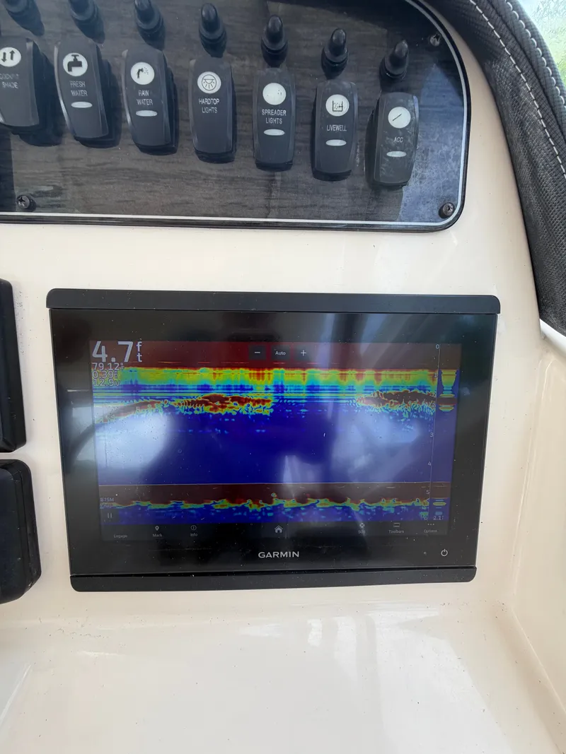 Slide: The Image of Interior view of a 2019 Grady-White Freedom 307 boat at dock. - 11