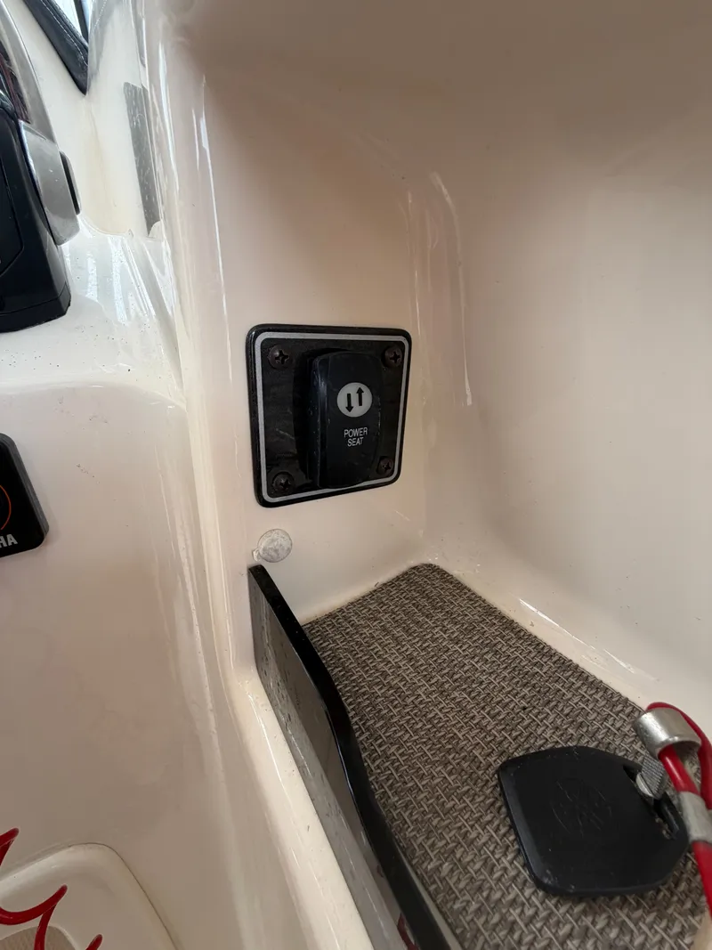 Slide: The Image of Grady-White Freedom 307 boat with open storage compartment, year 2019. - 13