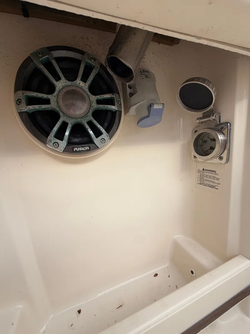 Slide: The Image of Interior of a 2019 Grady-White Freedom 307 boat with seating area. - 15