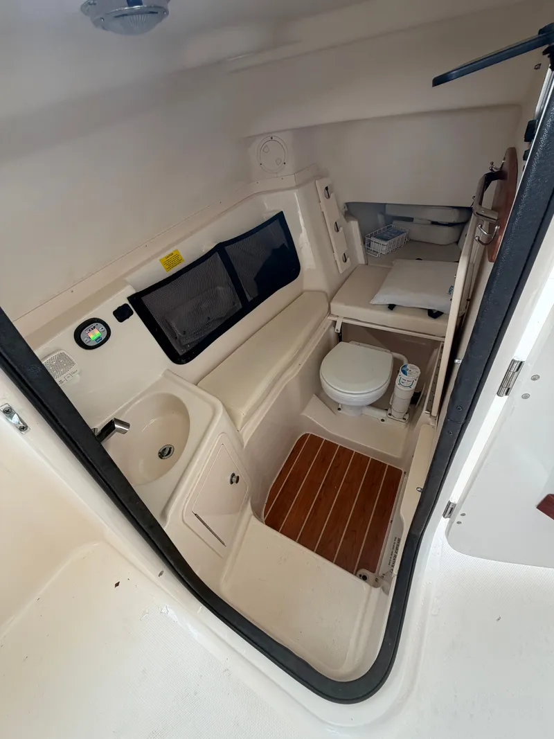 Slide: The Image of Interior of a 2019 Grady-White Freedom 307 boat with helm console. - 18