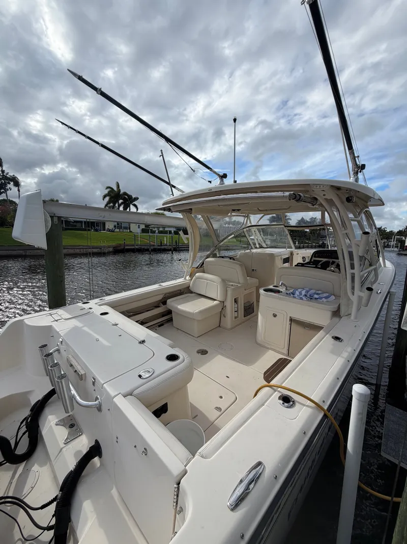 Slide: The Image of 2019 Grady-White Freedom 307 boat docked. - 2