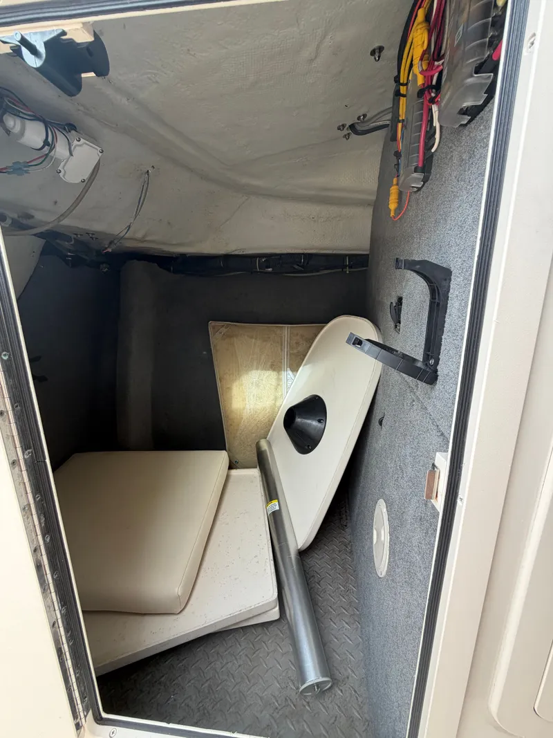 Slide: The Image of Interior of 2019 Grady-White Freedom 307 with toilet and mirror. - 29