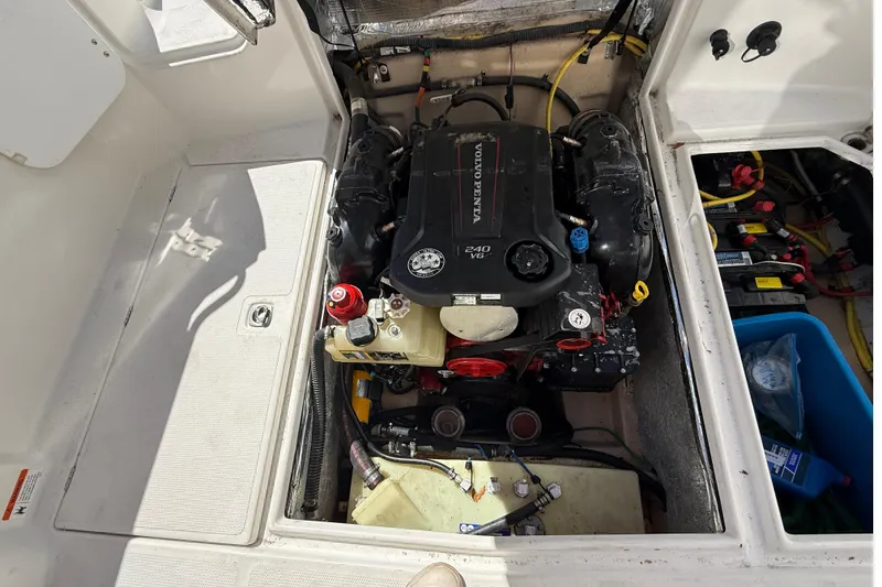 Slide: The Image of Engine compartment of a 2016 Cutwater 24 boat featuring a Volvo Penta 240 V6 engine. - 14