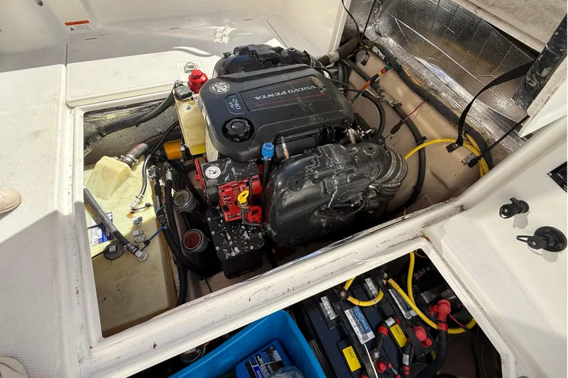 Slide: The Image of Engine compartment of a 2016 Cutwater 24 boat with Volvo Penta engine. - 16