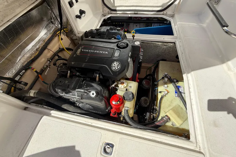 Slide: The Image of Engine compartment of a 2016 Cutwater 24 boat featuring a Volvo Penta engine. - 17
