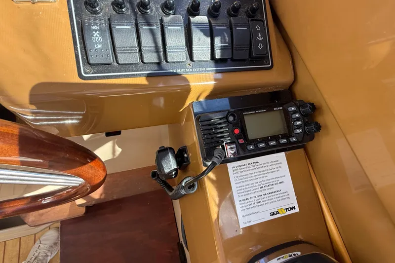 Slide: The Image of Control panel and radio equipment on a 2016 Cutwater 24 boat dashboard. - 28