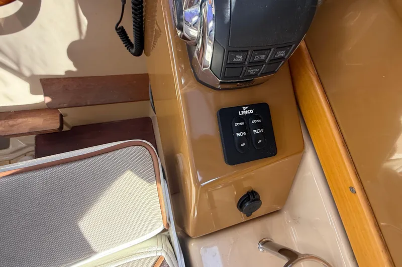 Slide: The Image of Control panel of a 2016 Cutwater 24 boat with Lenco trim tab switches. - 29