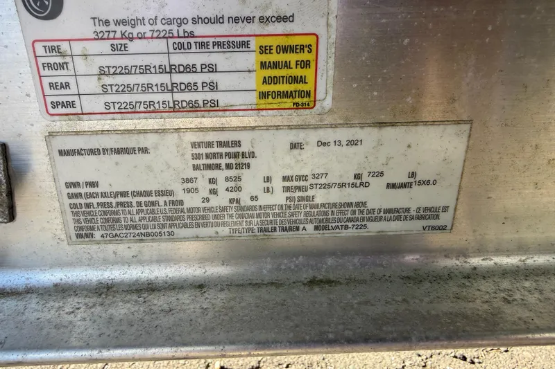 Slide: The Image of Label on a 2016 Cutwater 24 trailer detailing tire specifications and weight limits. - 39