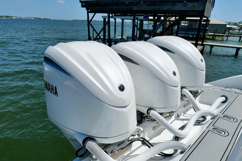 Slide: The Image of Triple Yamaha outboard engines on a 2018 Yellowfin 36 Offshore boat. - 10
