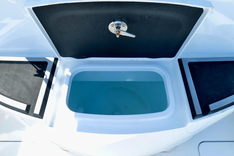 Slide: The Image of Livewell compartment on a 2018 Yellowfin 36 Offshore boat, open with visible water. - 14