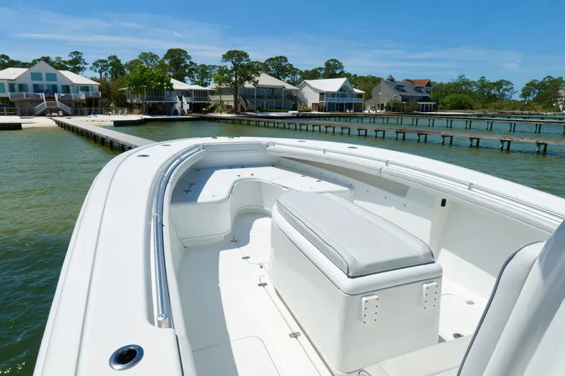 Slide: The Image of 2018 Yellowfin 36 Offshore boat docked near waterfront homes. - 25