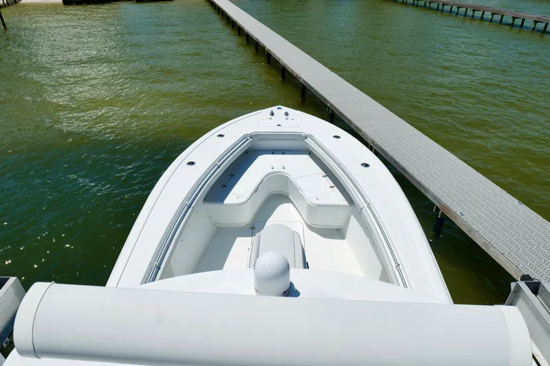 Slide: The Image of 2018 Yellowfin 36 Offshore boat docked on calm water, viewed from above. - 30