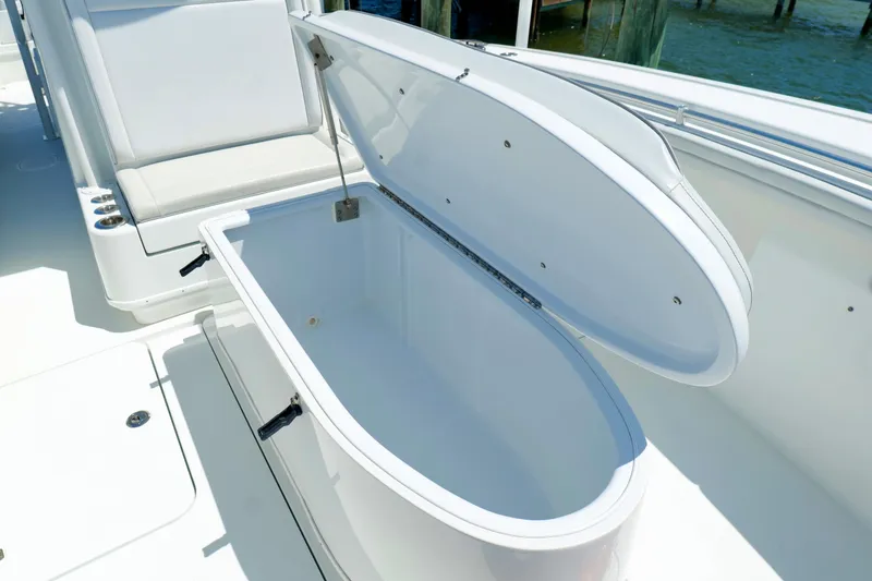 Slide: The Image of Open storage compartment on 2018 Yellowfin 36 Offshore boat deck. - 33