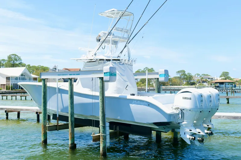 Slide: The Image of 2018 Yellowfin 36 Offshore boat with triple Yamaha engines on a lift. - 7