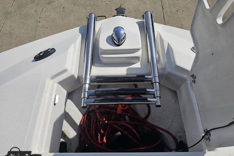 Slide: The Image of Bow area of 2008 Regal 2520 FasDeck with stainless steel ladder and red ropes. - 100